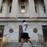 Moody’s lowers U.S. credit rating to ‘Aa1’